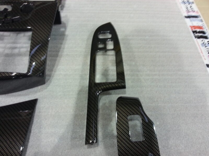 Car interior various elements coated in carbon fibre hydrographic film painted black
