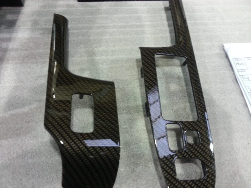 Car interior various elements coated in carbon fibre hydrographic film painted black