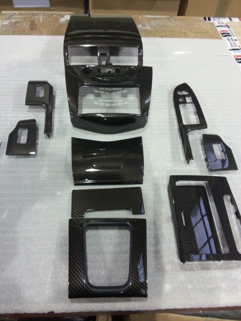 Car interior various elements coated in carbon fibre hydrographic film painted black