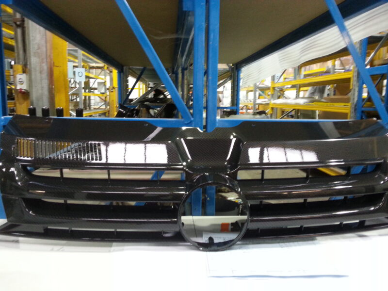 VW radiator grill coated in carbon fibre hydrographic film painted black