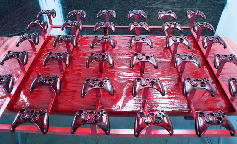 Gamepad coated in skull hydrographic film painted red
