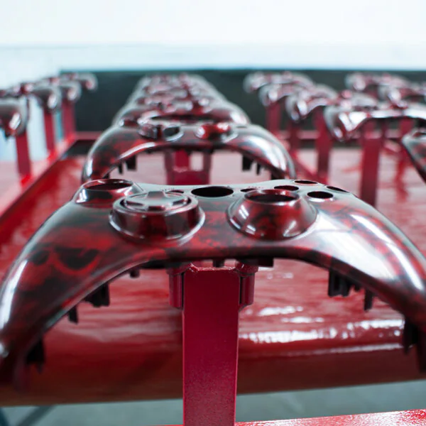 Gamepad coated in skull hydrographic film painted red
