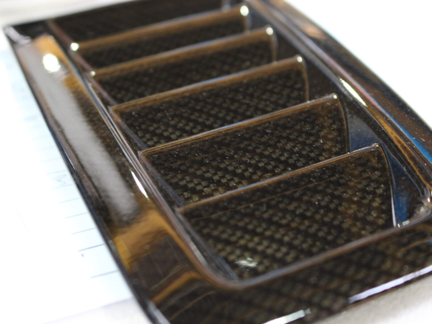 Car exterior element coated in carbon fibre hydrographic film painted black