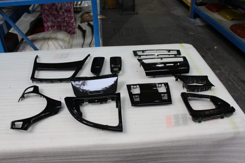 Car interior various elements coated in carbon fibre hydrographic film painted black