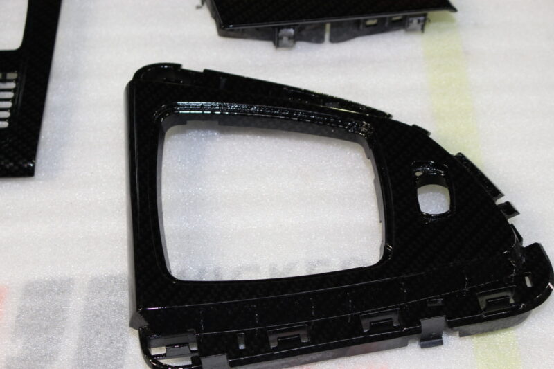 Car interior various elements coated in carbon fibre hydrographic film painted black