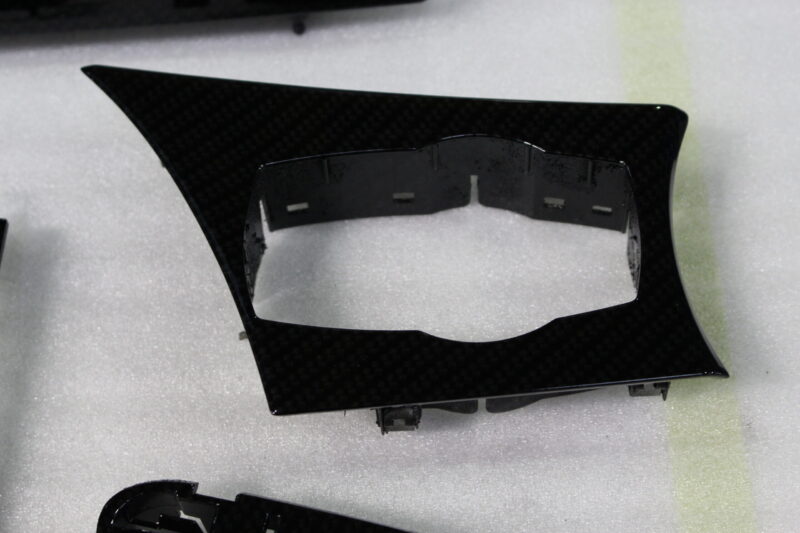Car interior various elements coated in carbon fibre hydrographic film painted black