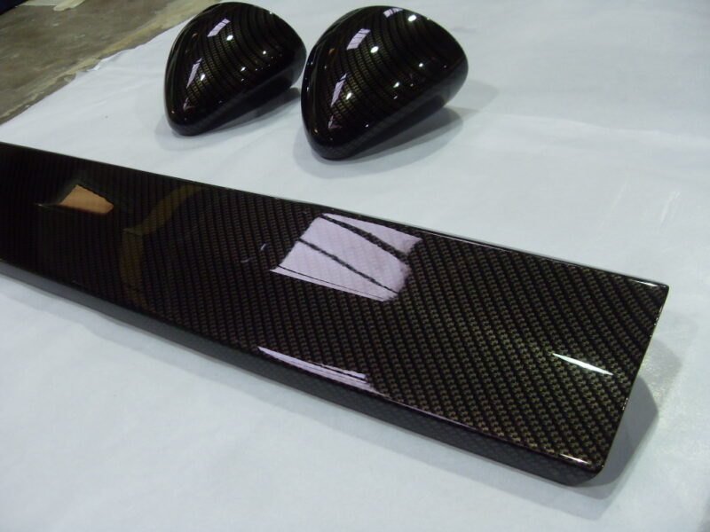 Motorbike various elements coated in carbon fibre hydrographic film painted black