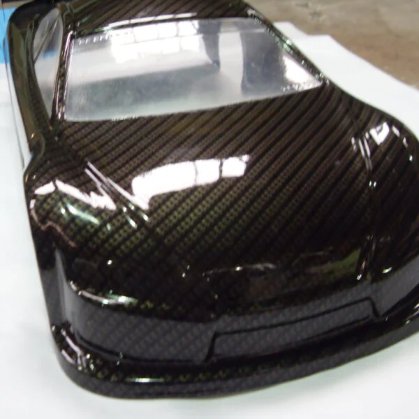 Car exterior model coated in carbon fibre hydrographic film painted black