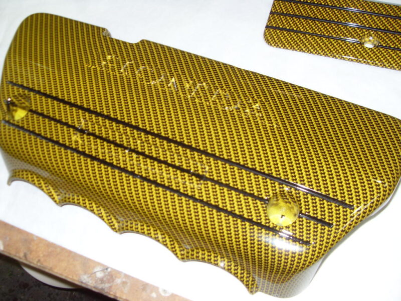 Honda engine elements coated in carbon fibre hydrographic film painted yellow