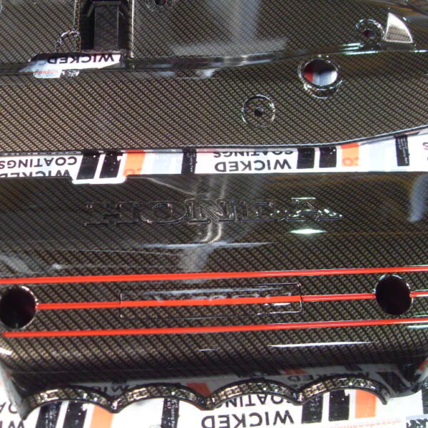 Honda engine parts coated in carbon fibre hydrographic film painted black