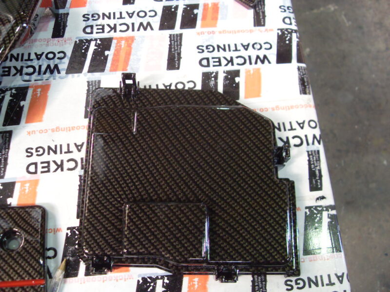 Honda engine parts coated in carbon fibre hydrographic film painted black