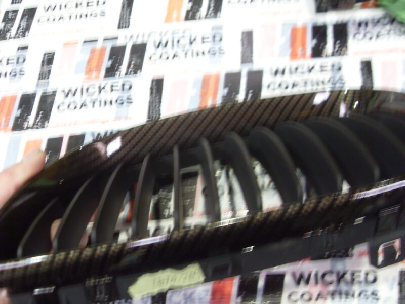 BMW radiator grill coated in carbon fibre hydrographic film painted black