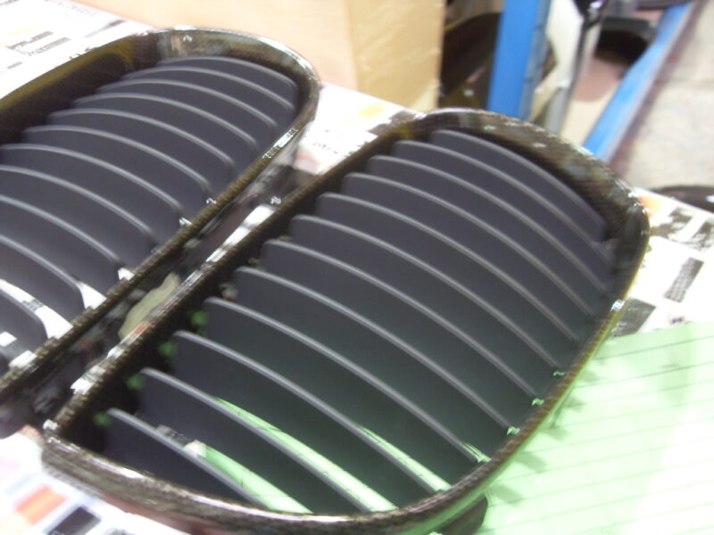 BMW radiator grill coated in carbon fibre hydrographic film painted black
