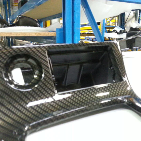 Car dashboard coated in carbon fibre hydrographic film painted black