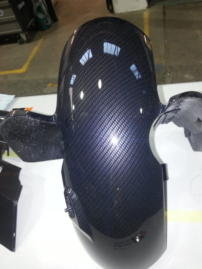 Motorbike element coated in carbon fibre hydrographic film painted black