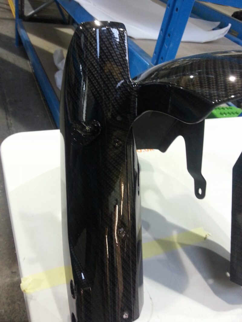 Motorbike element coated in carbon fibre hydrographic film painted black