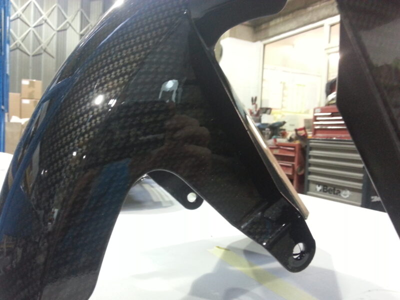 Motorbike element coated in carbon fibre hydrographic film painted black
