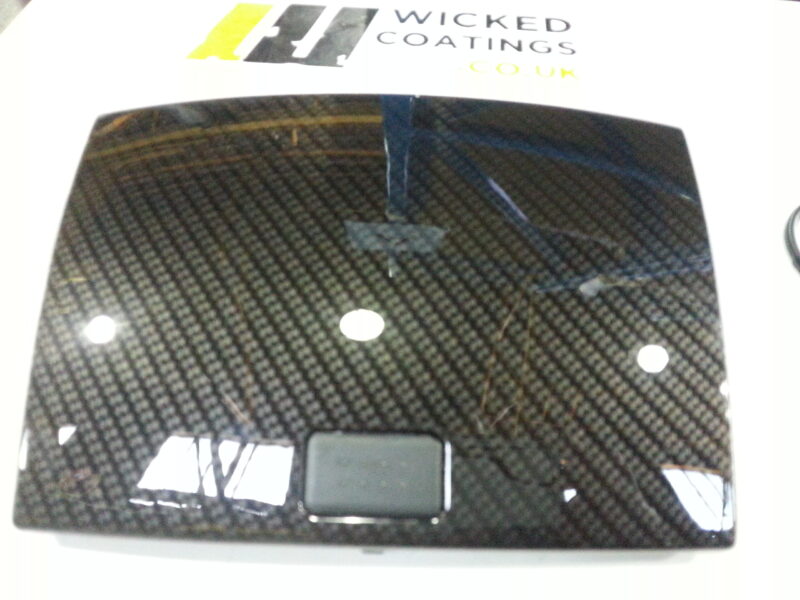 Car dashboard elements coated in carbon fibre hydrographic film painted black