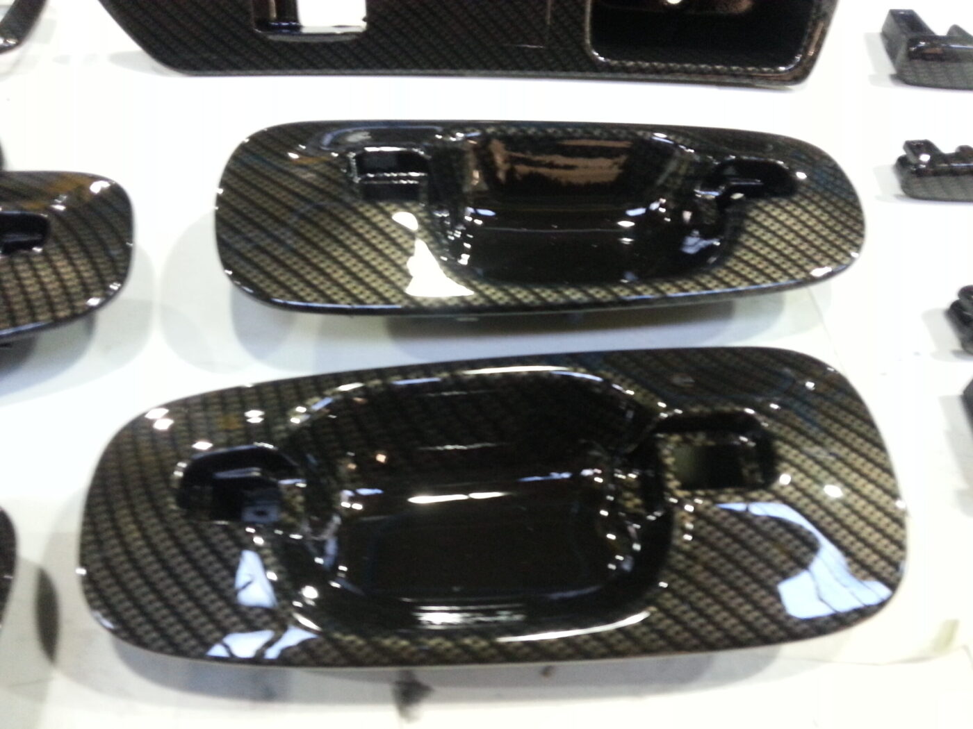 Car interior various elements coated in carbon fibre hydrographic film painted black