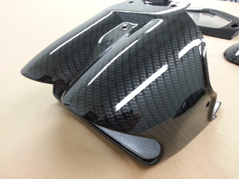 Motorbike elements coated in carbon fibre hydrographic film painted black