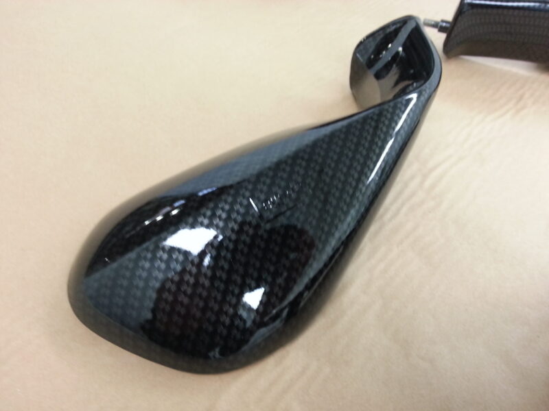 Motorbike elements coated in carbon fibre hydrographic film painted black