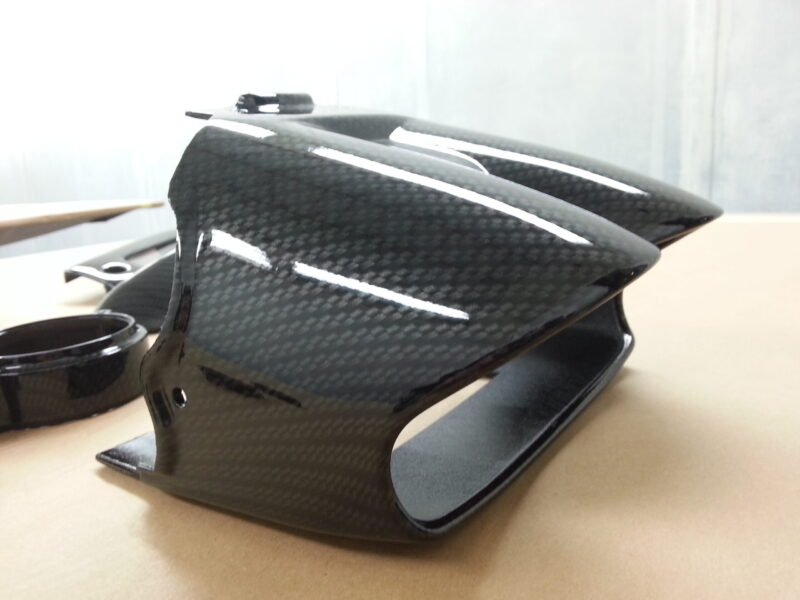 Motorbike elements coated in carbon fibre hydrographic film painted black